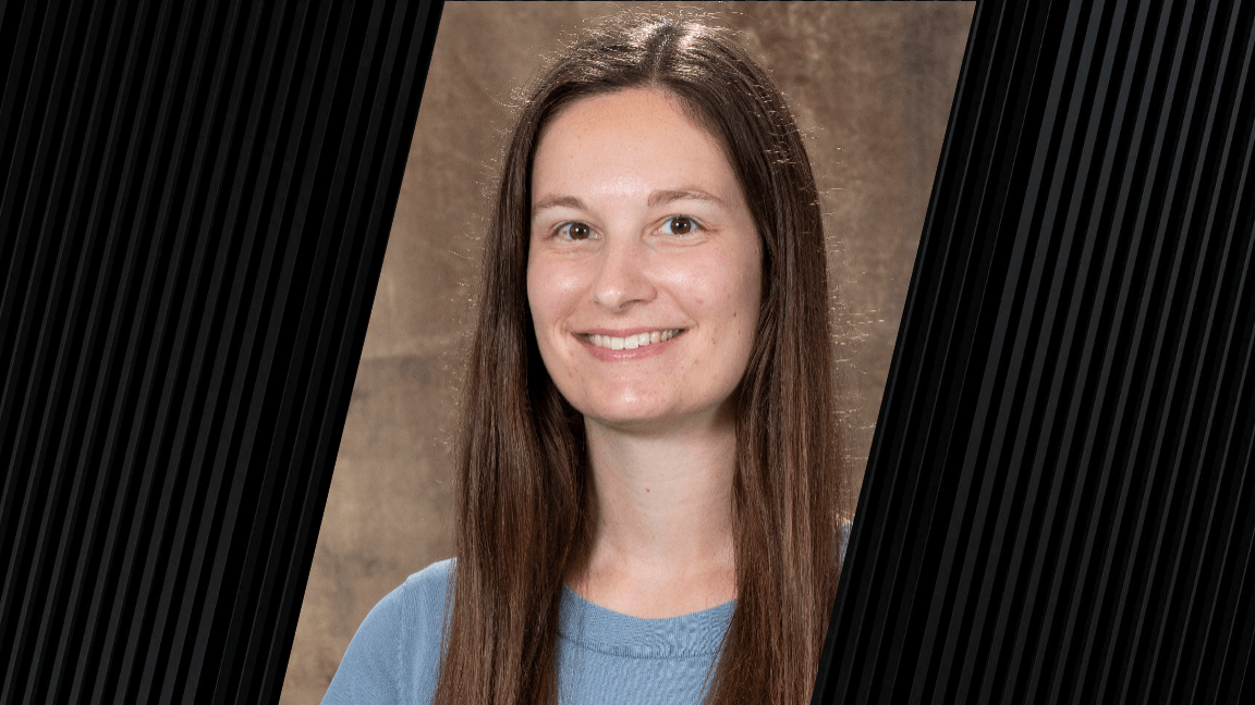 Female with long brown hair wearing a light blue shirt