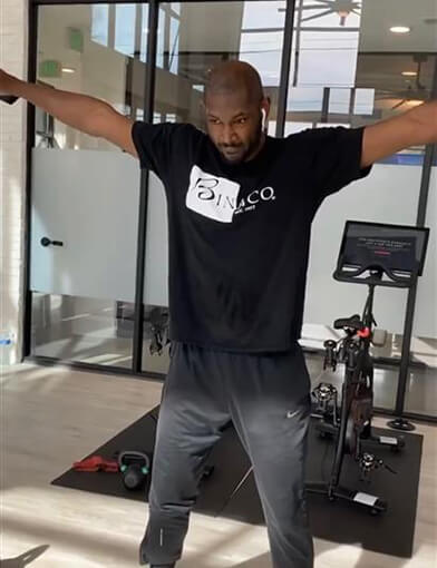 Darryl Bigelow working out lifting weights.