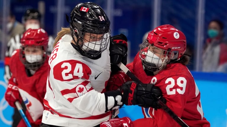 Canada's Natalie Spooner (24) and Russian Olympic Committee's Alexandra Vafina...