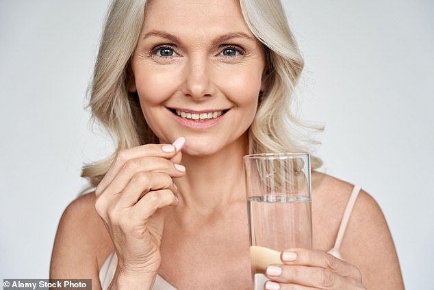 Half of UK adults take a multivitamin regularly, data from The Grocer shows. However, over the past decade, research has suggested that taking them might not be as beneficial as we think (picture posed by model)
