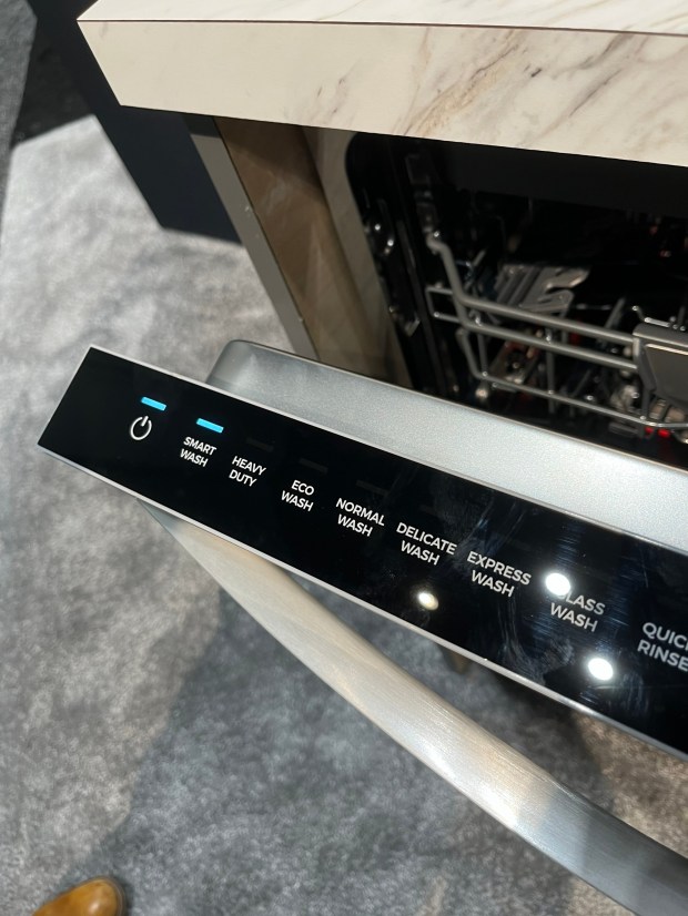 Kenmore's newest dishwasher offers a smart wash setting and a bottom rack that springs up to waist level. (GrowthSpotter staff)