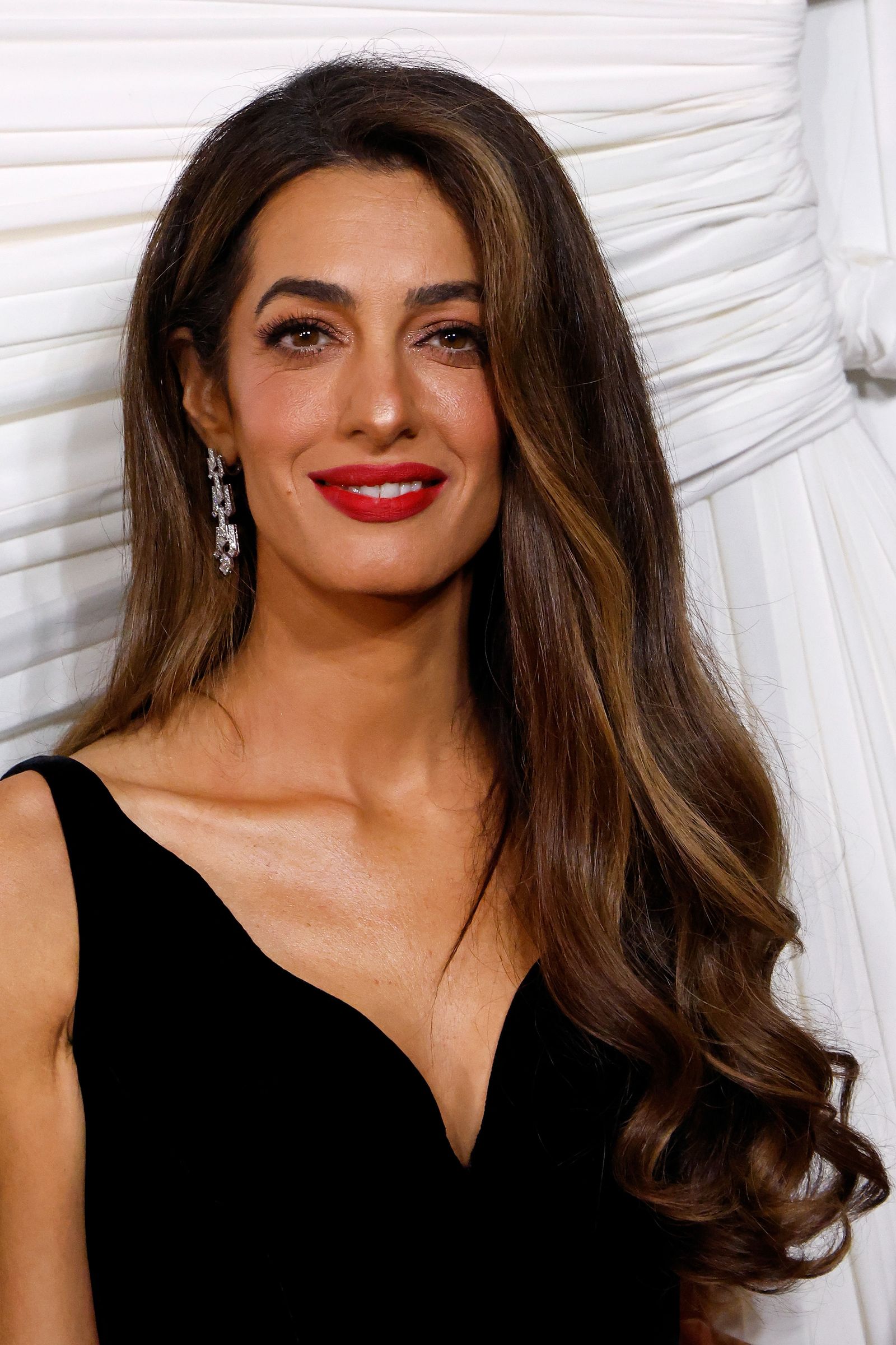 Image may contain Amal Clooney Adult Person Brown Hair Hair Head Face Body Part and Neck