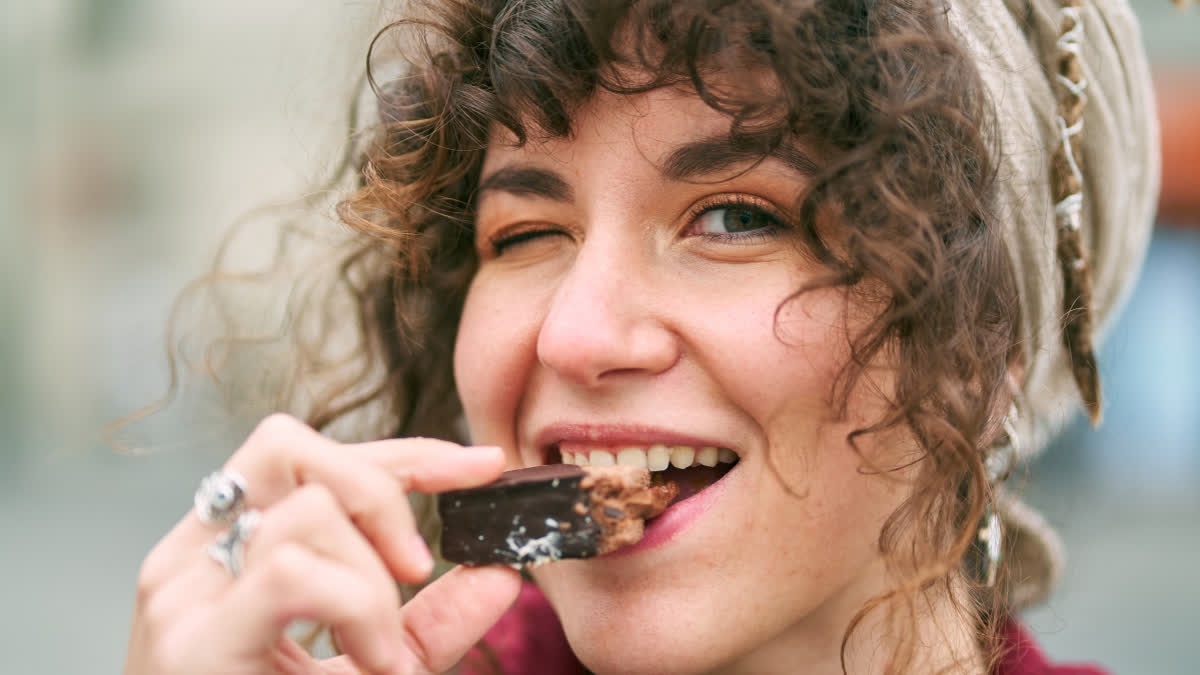 Girl eating chocolate