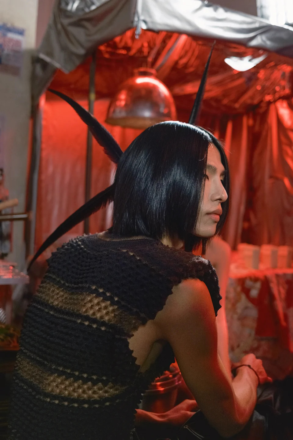 Model with feathers in hair