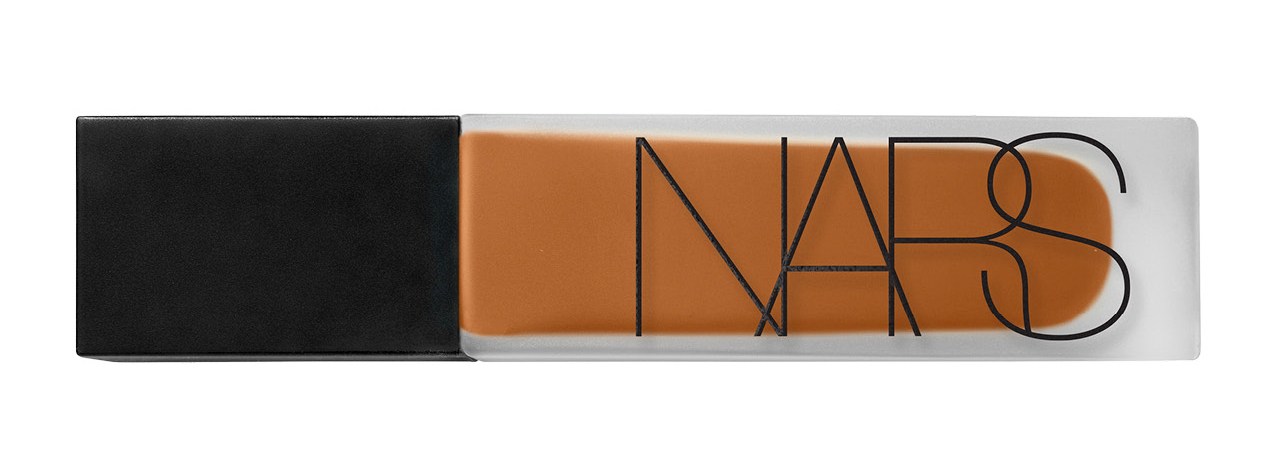 A rectangular NARS cosmetic product, possibly foundation or concealer, in a frosted clear bottle with a black cap, filled with a warm tan liquid.