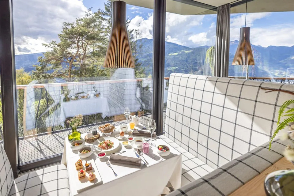 The restaurant is design-led with warm pendant lighting (My Arbor)