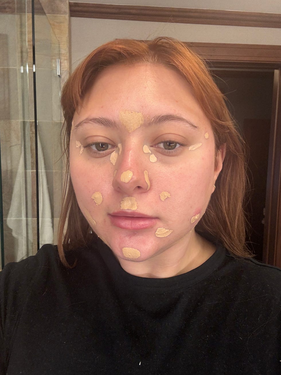 Selfie taken in a bathroom environment.