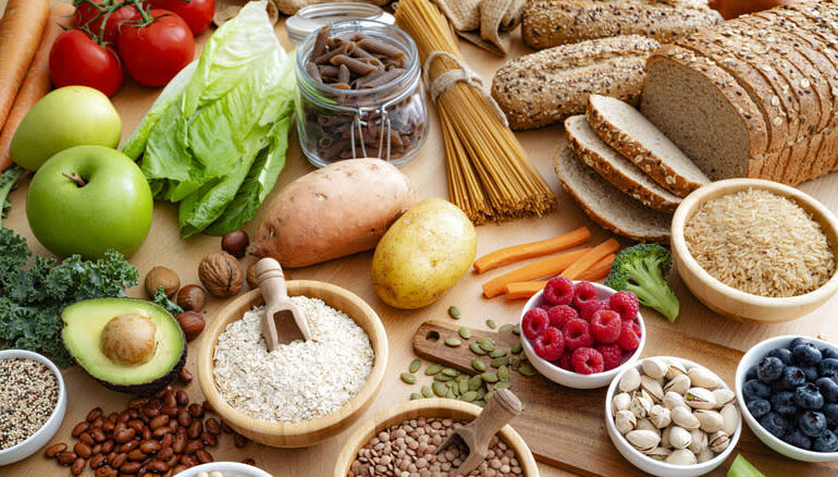 Variety of high fiber foods like whole-grain breads, beans, vegetables, and fruits