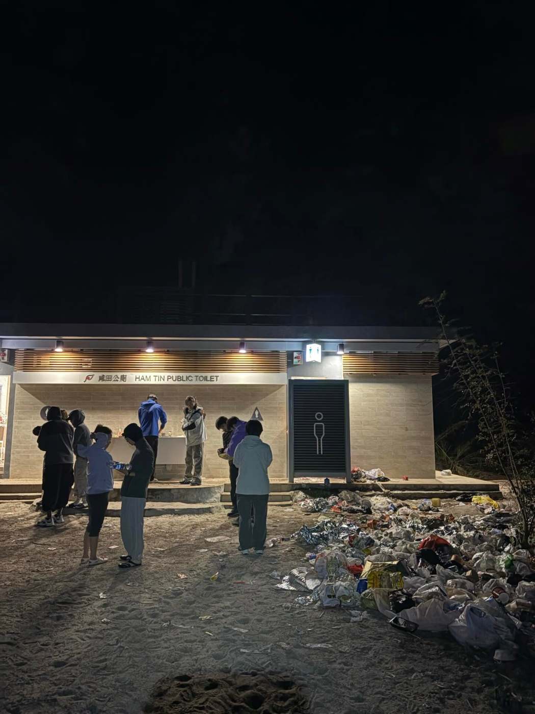 This photo circulating on social media platform Threads shows litter filled the area in front of Ham Tin Public Toilet in Sai Kung on New Year's Eve in 2025. Photo: via bill,kolder on Threads.