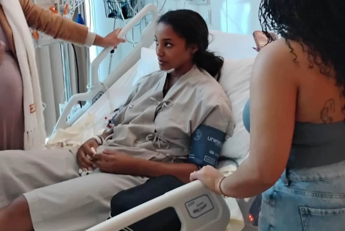 The 2025 Miss Universe Jamaica titleholder resting in a hospital bed