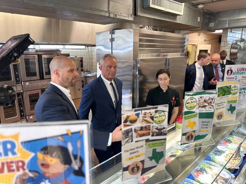 Robert F. Kennedy, Jr. tours a kitchen at an Austin ISD school