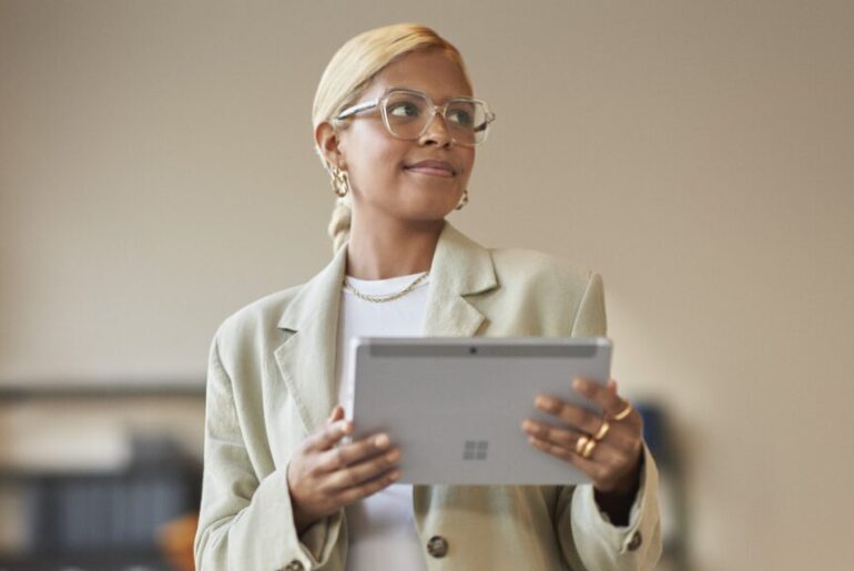 woman holding tablet.
