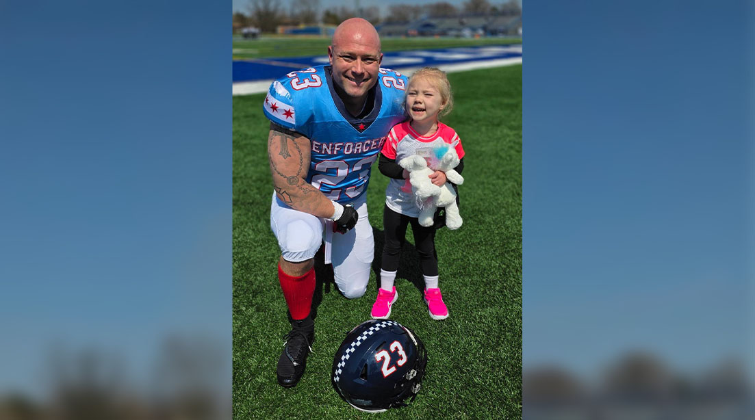 Firefighter and Strongman Doug Hardtke with his daughter