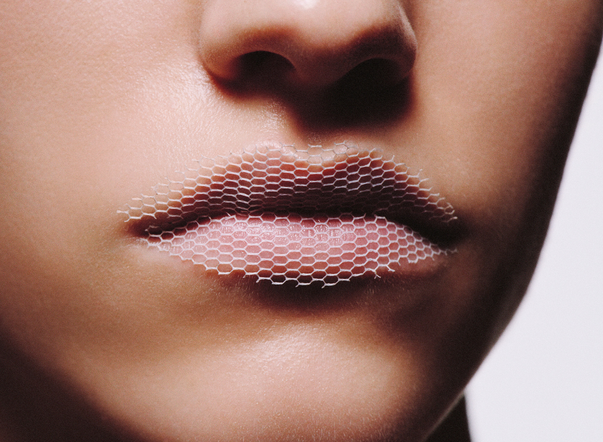 Woman wearing Celine lipstick with mesh on top