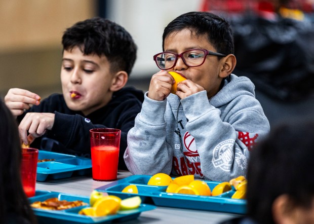 First grader Adrian Gomez eats an orange, one of his favorite foods, while eating lunch at Centennial Elementary in Greeley on Thursday, Feb. 5, 2026. (Brice Tucker/Staff Photographer)