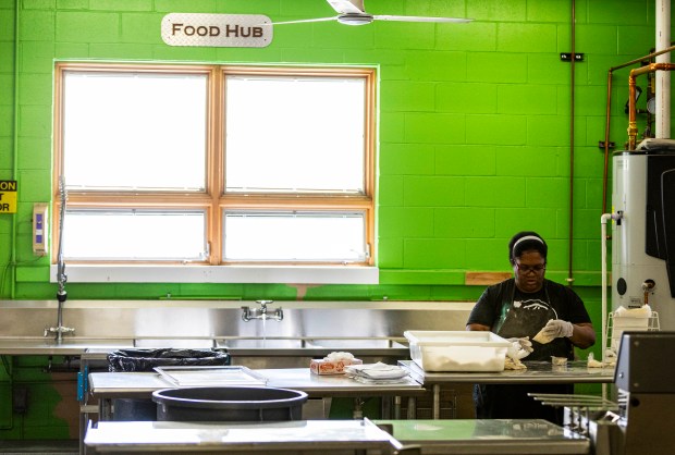 Simone Spivey makes ranch dressing packets for school district cafeterias at Greeley-Evans School District's Central Production Kitchen in Greeley on Thursday, Feb. 5, 2026. (Brice Tucker/Staff Photographer)