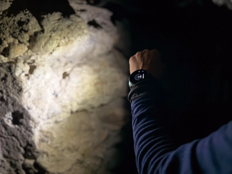 the author using the vertical 2 flashlight in the dark