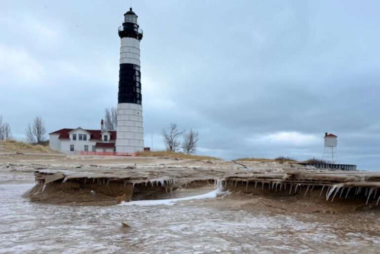 Draped in winter beauty, this iconic Lake Michigan lighthouse is a snowshoe hike away