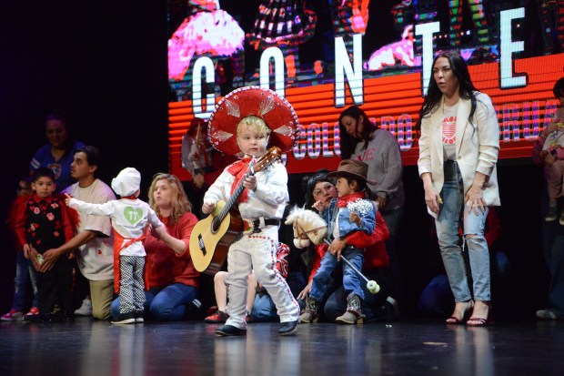 Mr. Cupid, three-year-old Liam LeClair-Brooks, captivated audience members with his mariachi costume and guitar. His mom, Monica LeClair-Brooks, said the costume was inspired by her family's heritage. (Sharla Steinman/ Loveland Reporter-Herald)