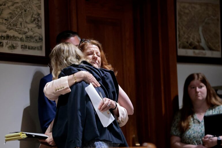 Rory McCarthy, left, a former patient of Dr. Derrick Todd who said he sexually abused her, was embraced by Representative Jenny Armini after she testified in front of the Joint Committee on Public Health at the State House.