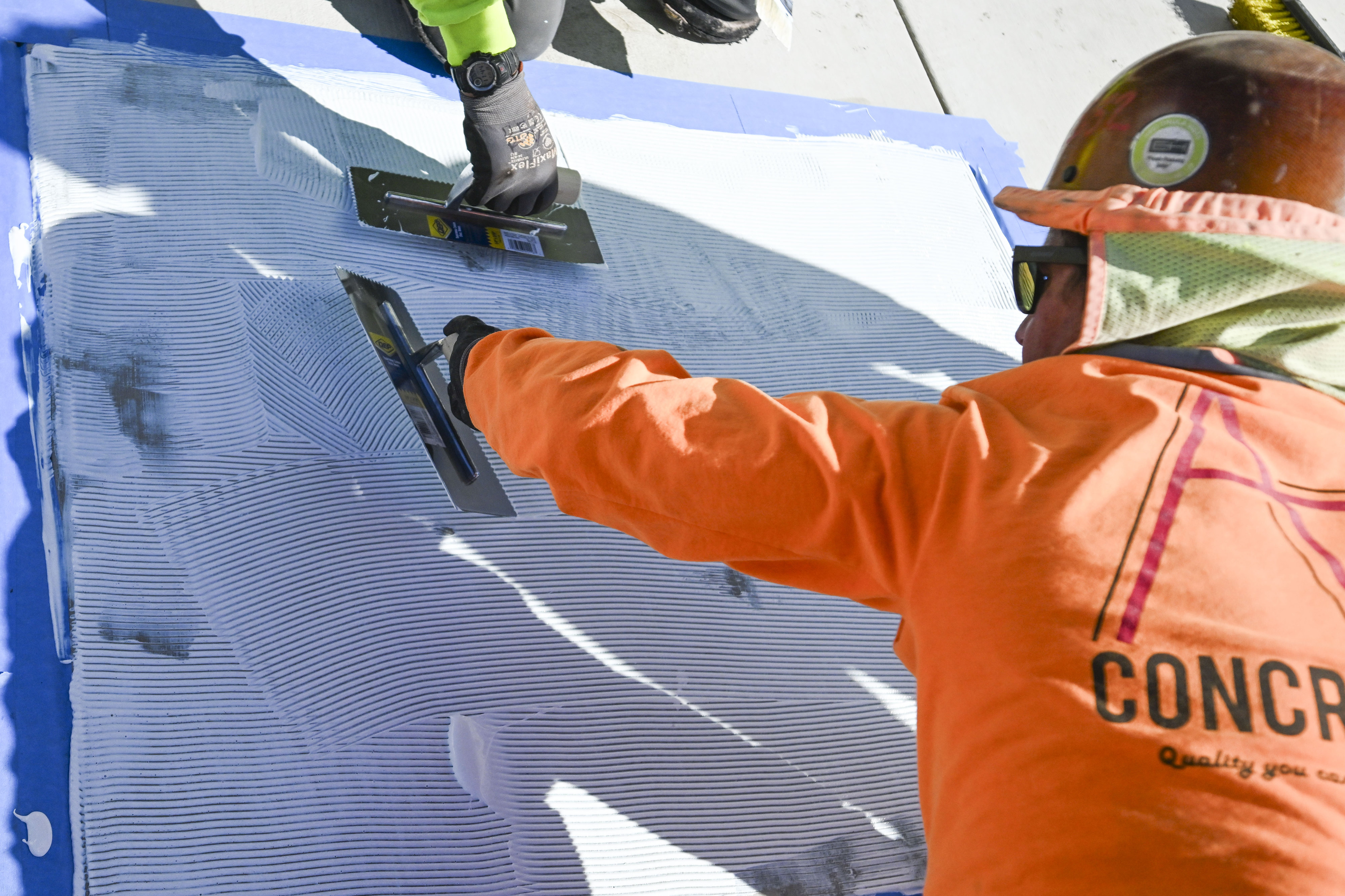 Construction workers put finishing touches on the San Bernardino Community...
