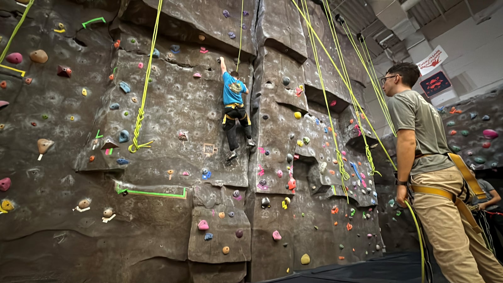 A boy tries out a climbing wall during the Adventure Summit at Wright State University on Saturday, Feb. 21, 2026. CORNELIUS FROLIK / STAFF