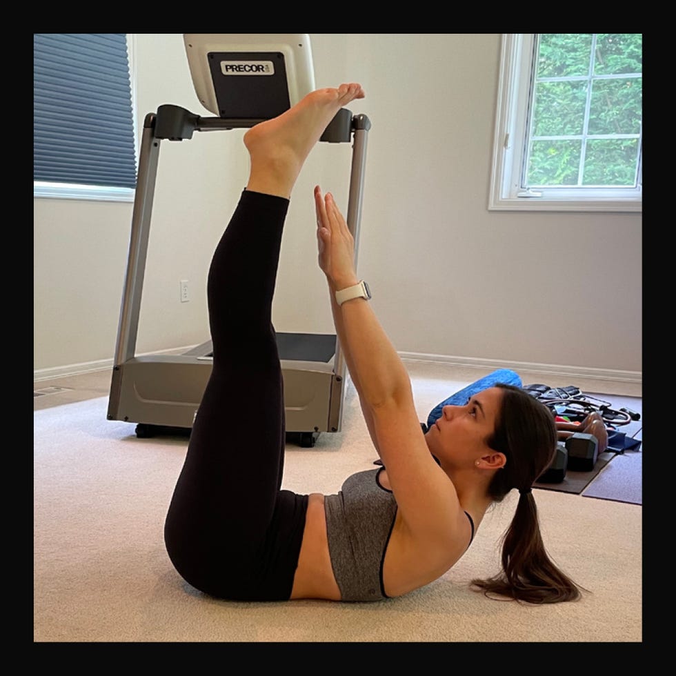 exercise routine focused on core strengthening with raised legs and arms exercise routine focused on core strengthening with raised legs and arms