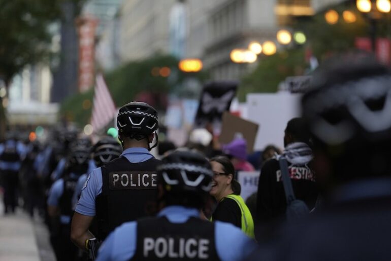 Police walk along as people march during Illinois Coalition for Immigrant & Refugee Rights' "Chicago Says No Trump No Troops" protest Sept. 6, 2025, in Chicago. (AP)