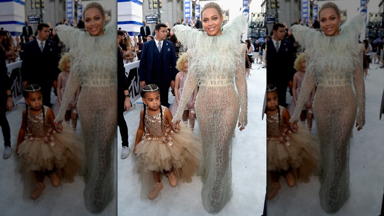 Beyoncé and Blue Ivy Carter walking the white carpet at the 2016 VMAs