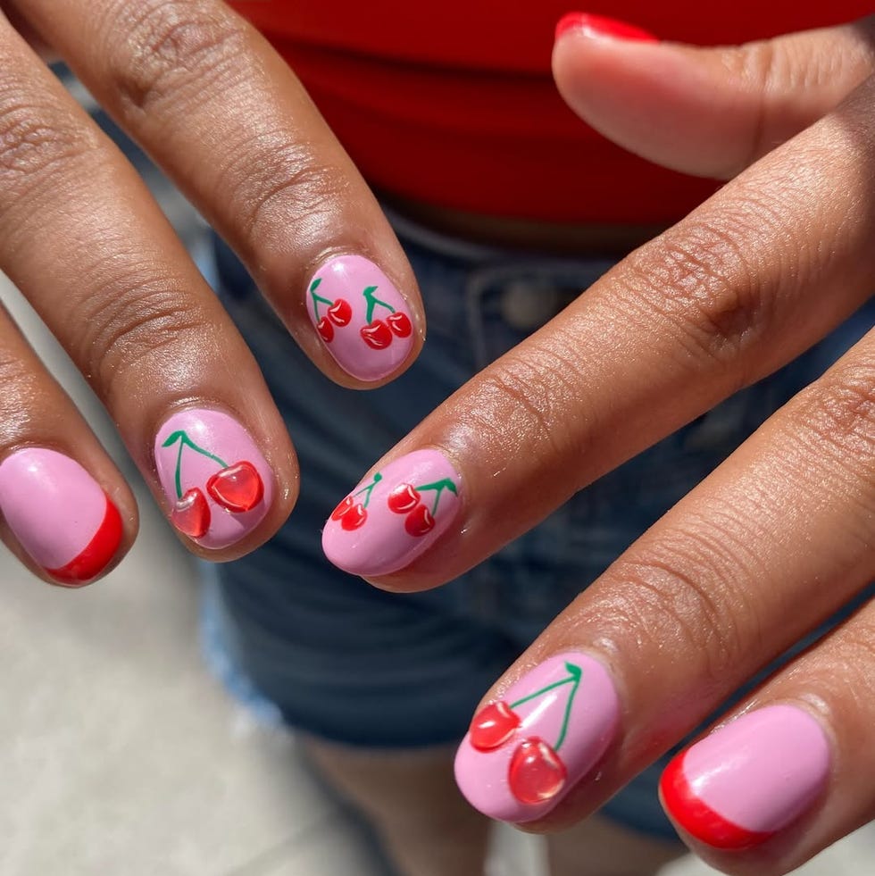 nails designed with pink polish and cherry patterns nails designed with pink polish and cherry patterns