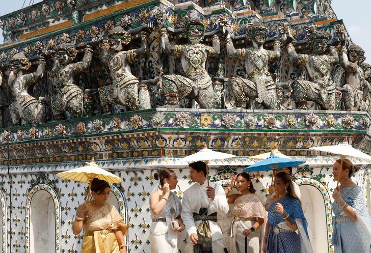 Tourists dressed in traditional Thai attire visit the Temple of Dawn in Bangkok, Thailand, Jan. 19. The Tourism Authority of Thailand aims to attract 36.7 million foreign visitors in 2026. EPA-Yonhap