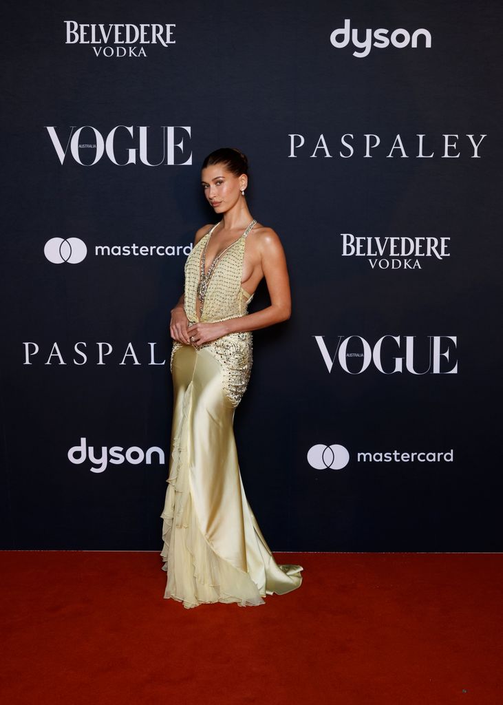 Hailey Bieber in yellow embellished dress attends the Vogue Australia Summer Ball 2026 at Sydney Opera House 