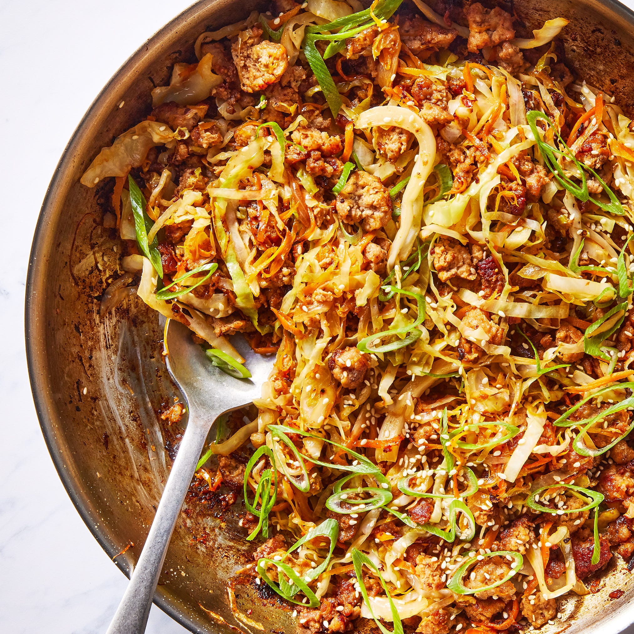 ground pork, cabbage and carrot in a bowl