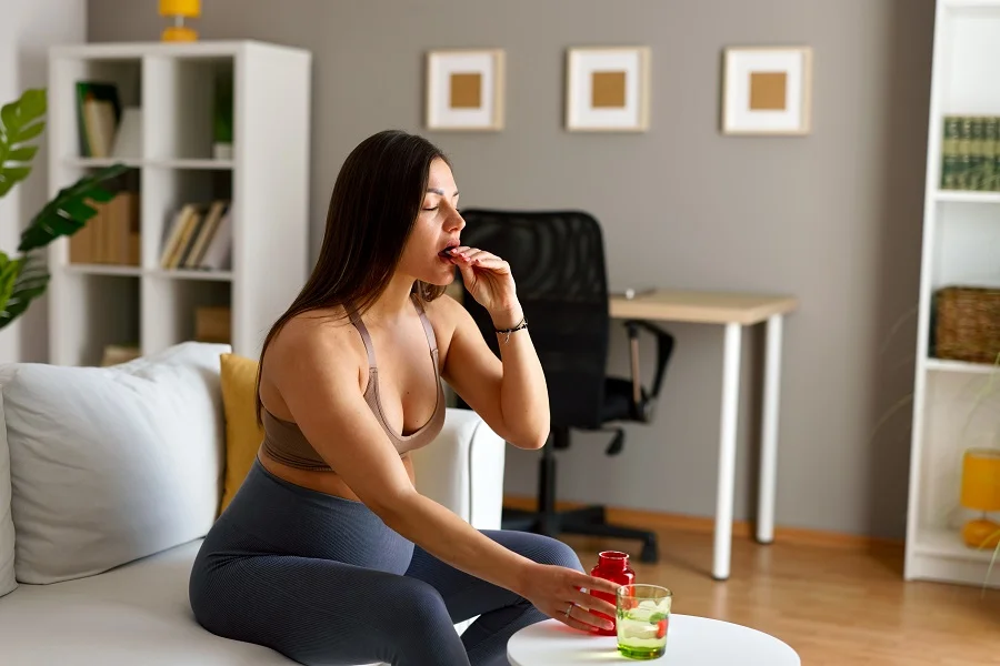 Pregnant woman taking supplements