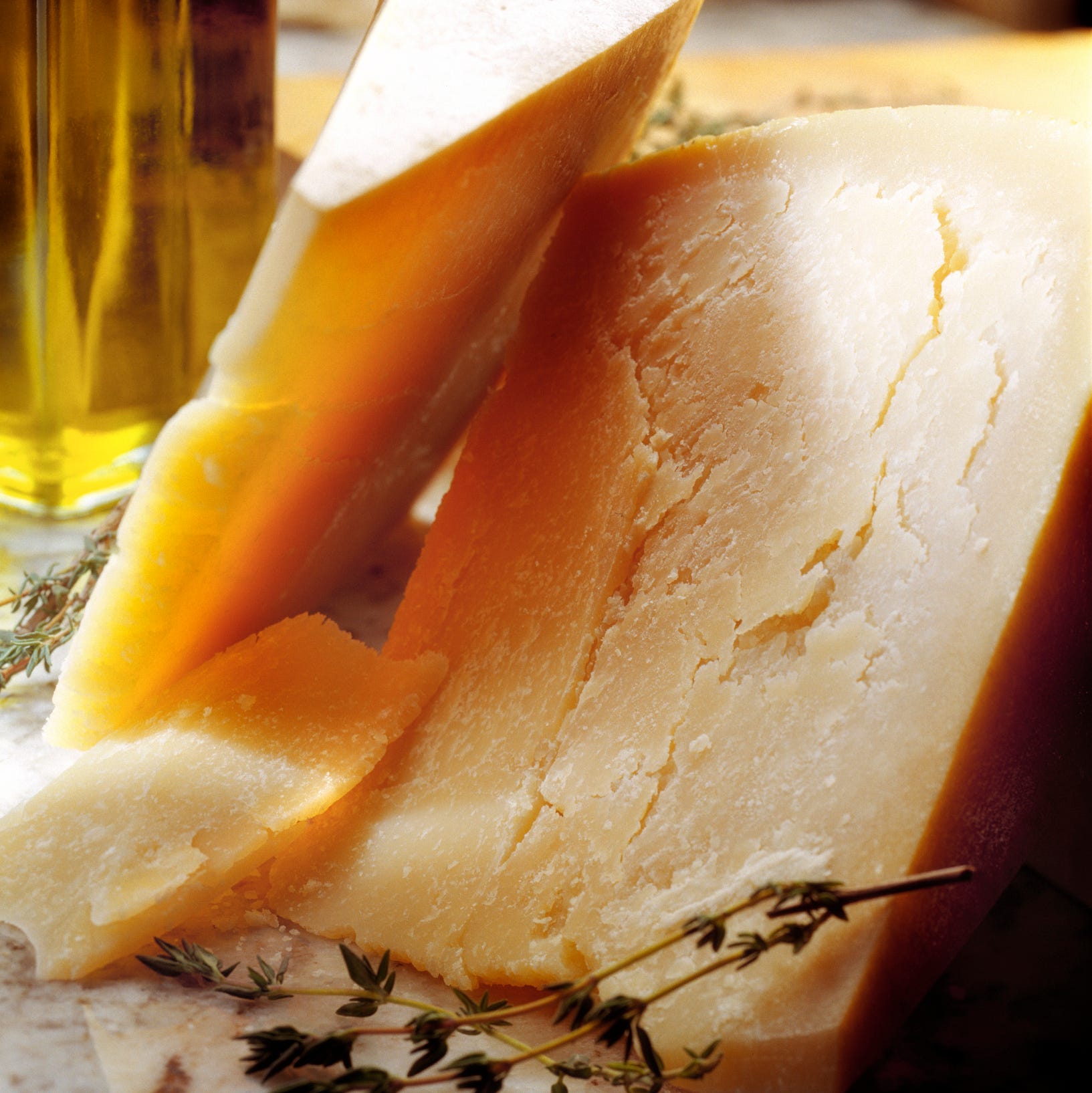 selective focus of hard cheddar cheese on tabletop