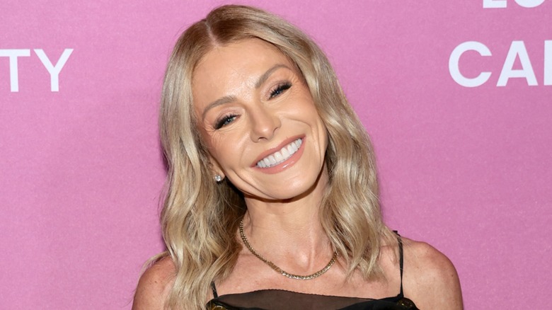 Kelly Ripa tilting her head and smiling