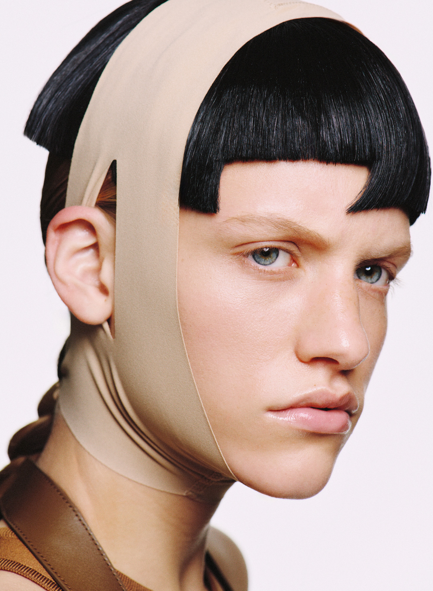 Woman wearing Skims face mask