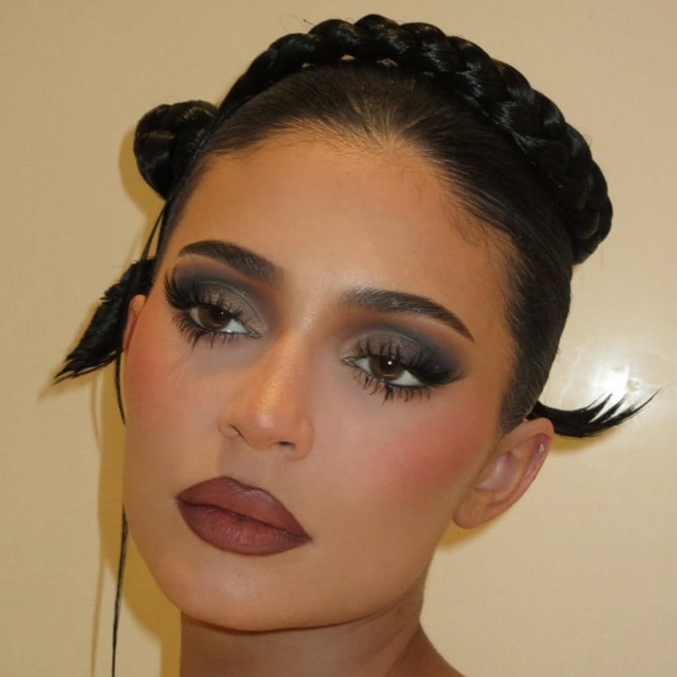 woman with dark eye makeup