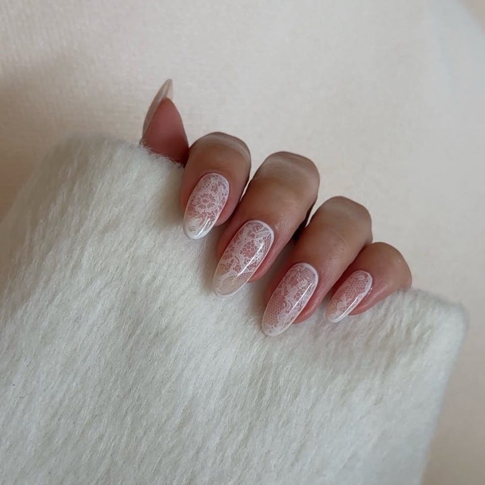 nail art with lace designs shown against a soft white background nail art with lace designs shown against a soft white background