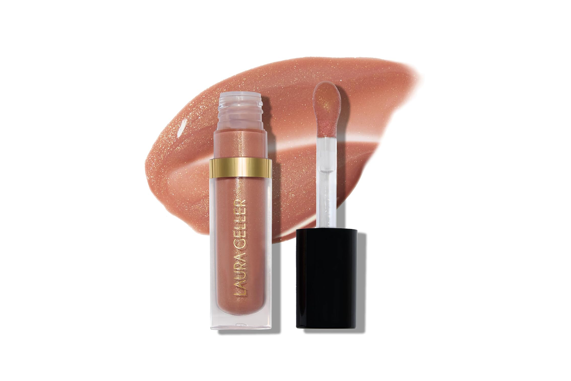 A clear tube of Laura Geller Jelly Balm lip gloss in a light brown shade with a gold-colored band, with the applicator wand beside it, on top of a swatch of the gloss.