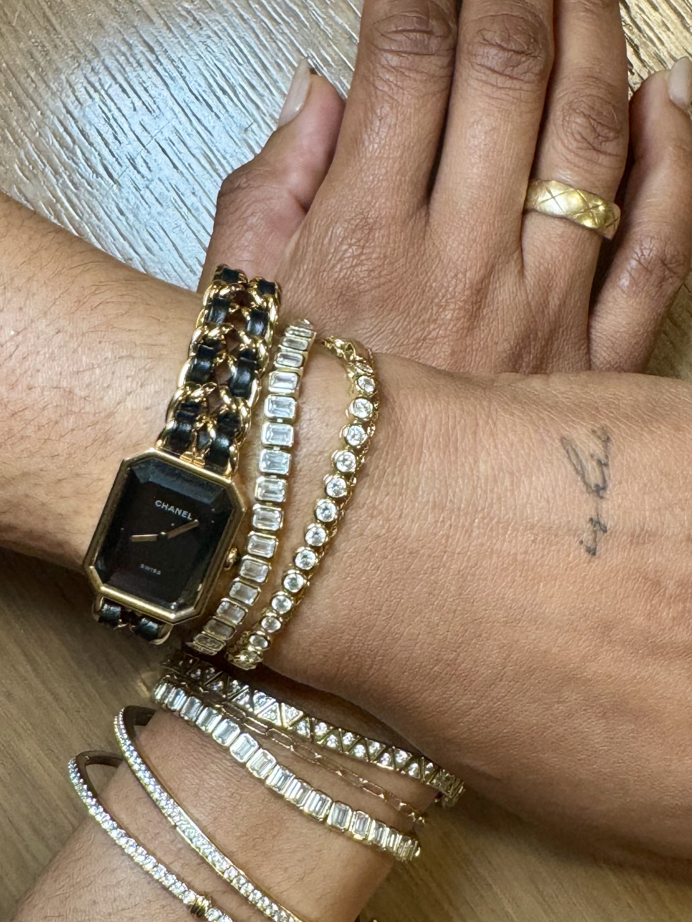 Person with a fine-line tattoo on their hand.