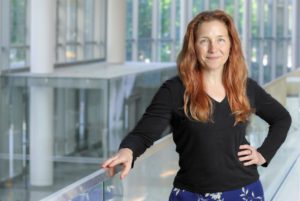 Stephanie Eisenbarth with hand on a railing