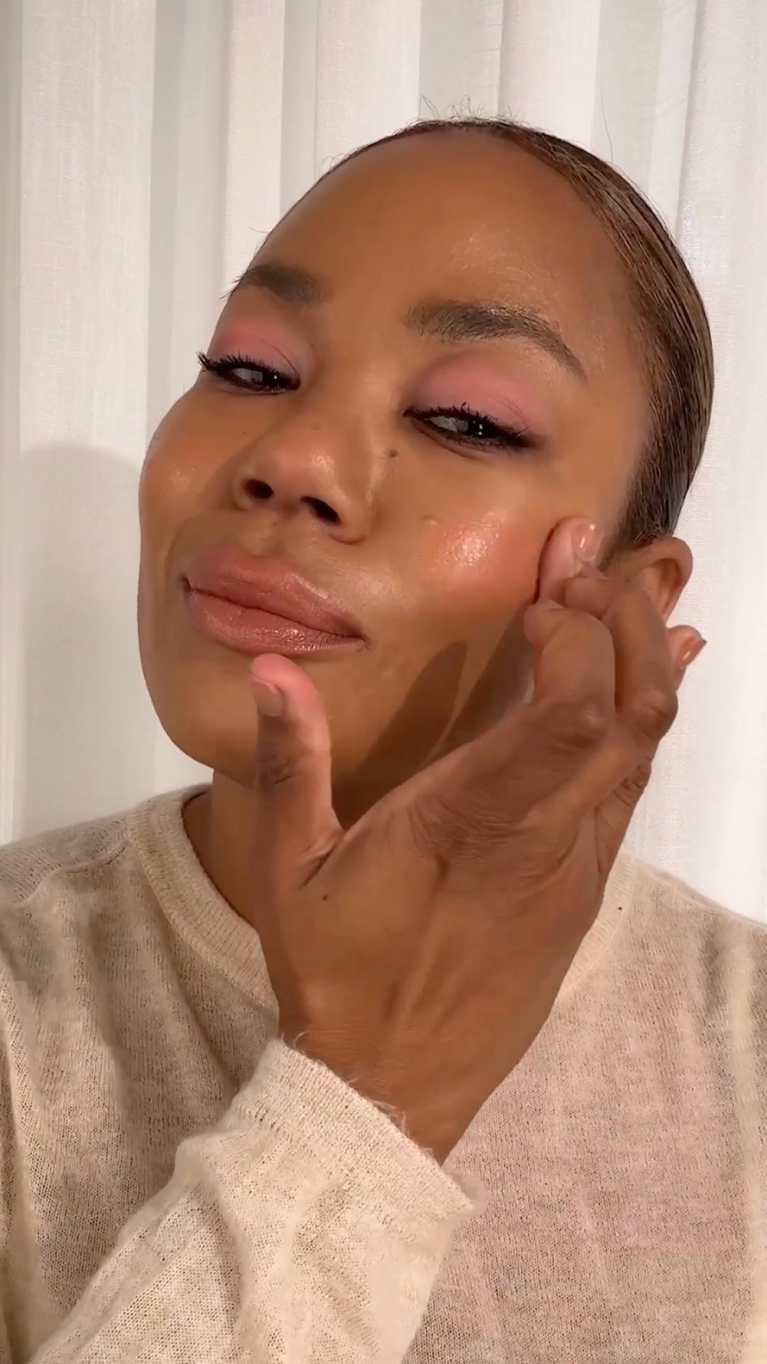 Tasha Reiko Brown applying watercolor makeup.