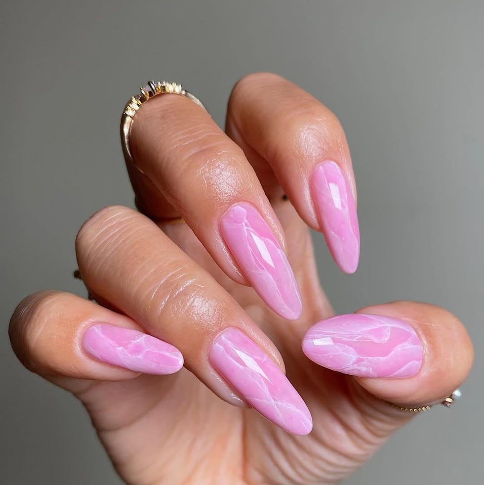 stylized long pink marbled nails with visible rings stylized long pink marbled nails with visible rings
