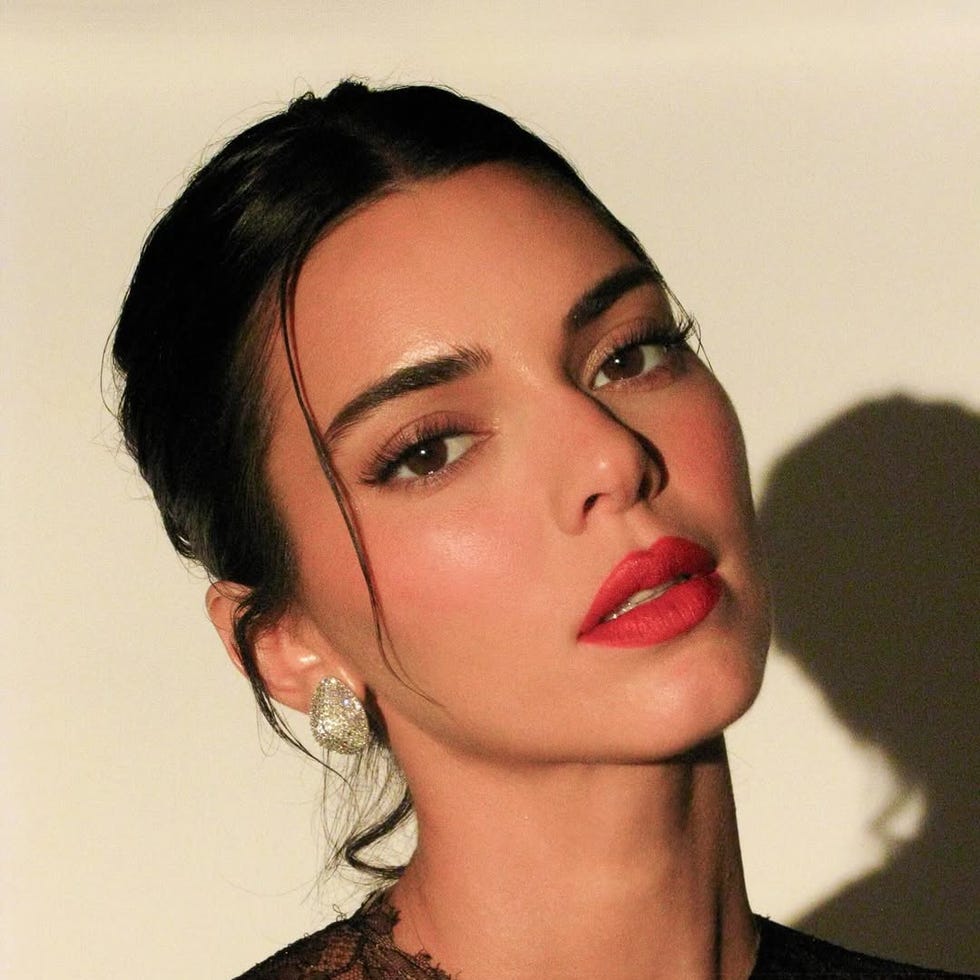 closeup of a person wearing a lace garment focusing on the neck and upper shoulder area