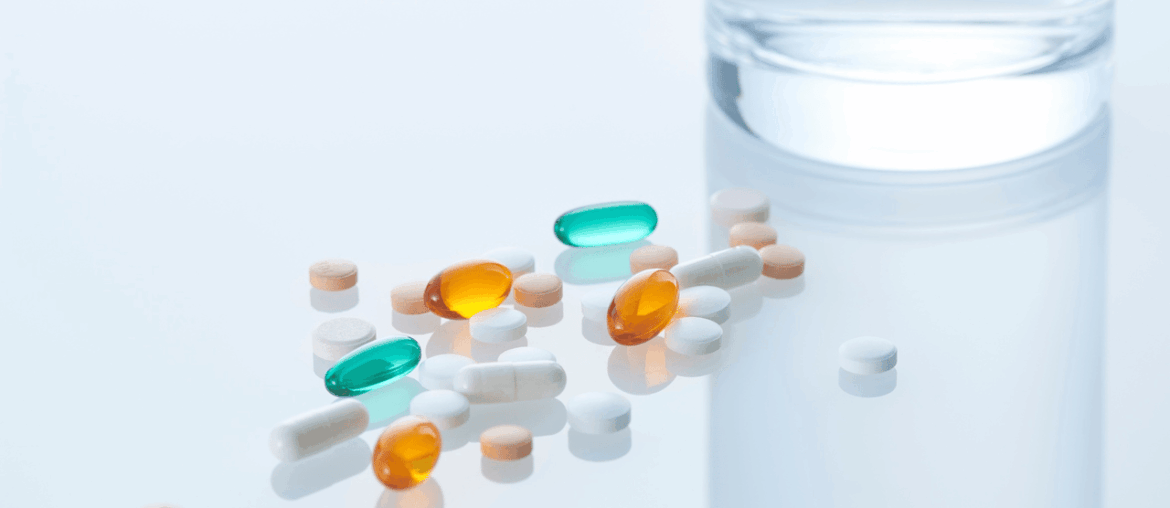 Pills on clear glass table