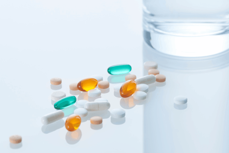 Pills on clear glass table