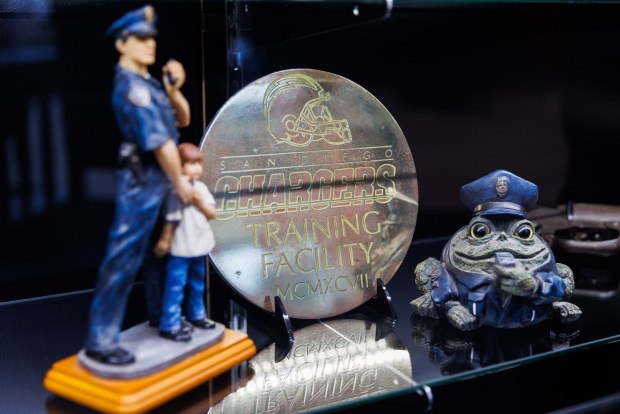 A San Diego Chargers training facility plaque is displayed in a case at San Diego Police Plaza on Wednesday. (Kristian Carreon / The San Diego Union-Tribune)