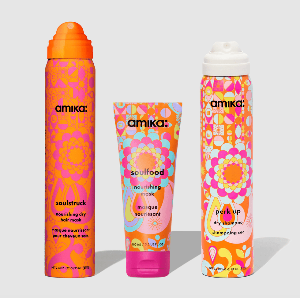 Three colorful Amika hair product bottles with vibrant floral patterns.