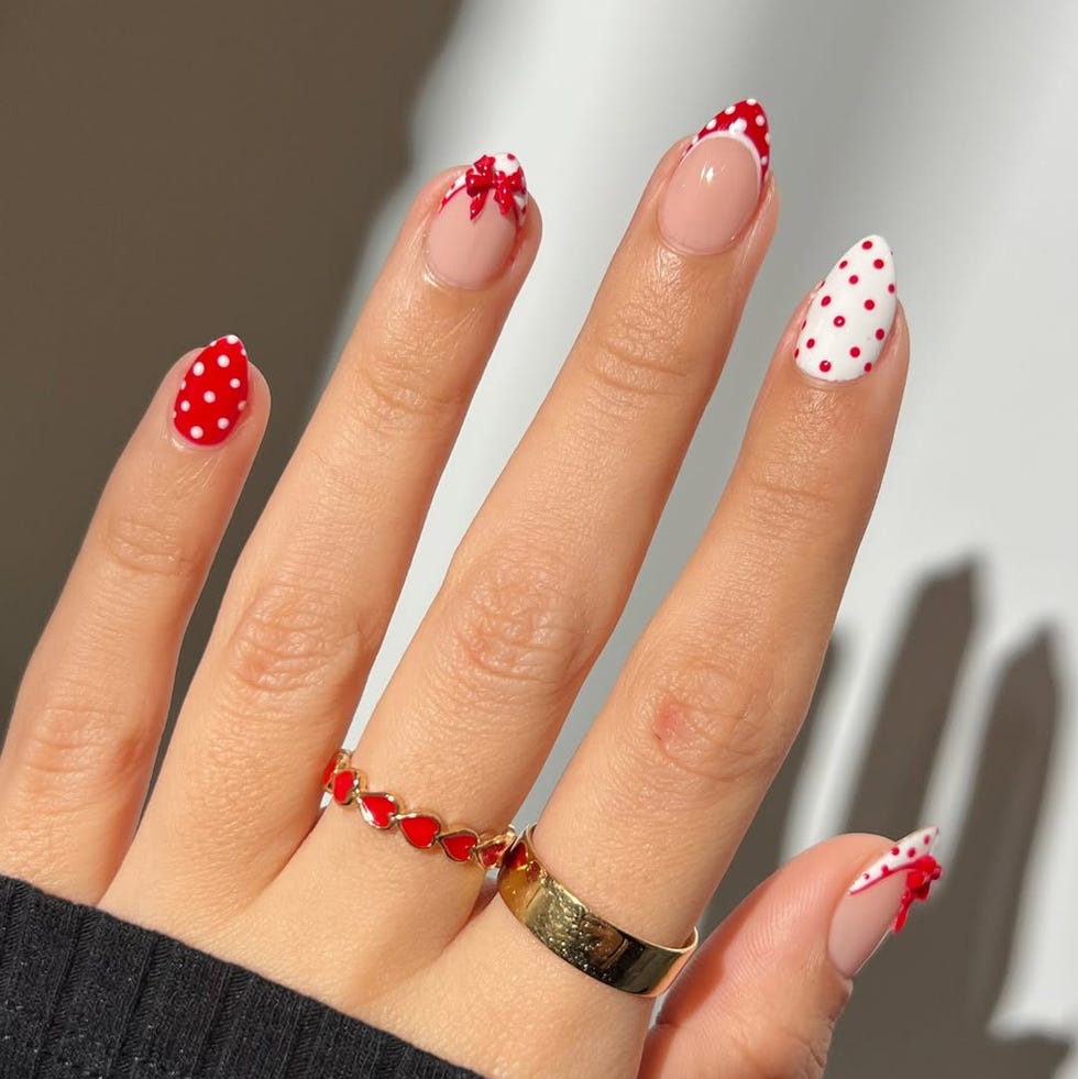 closeup of a wellmanicured hand with nail art and jewelry closeup of a wellmanicured hand with nail art and jewelry
